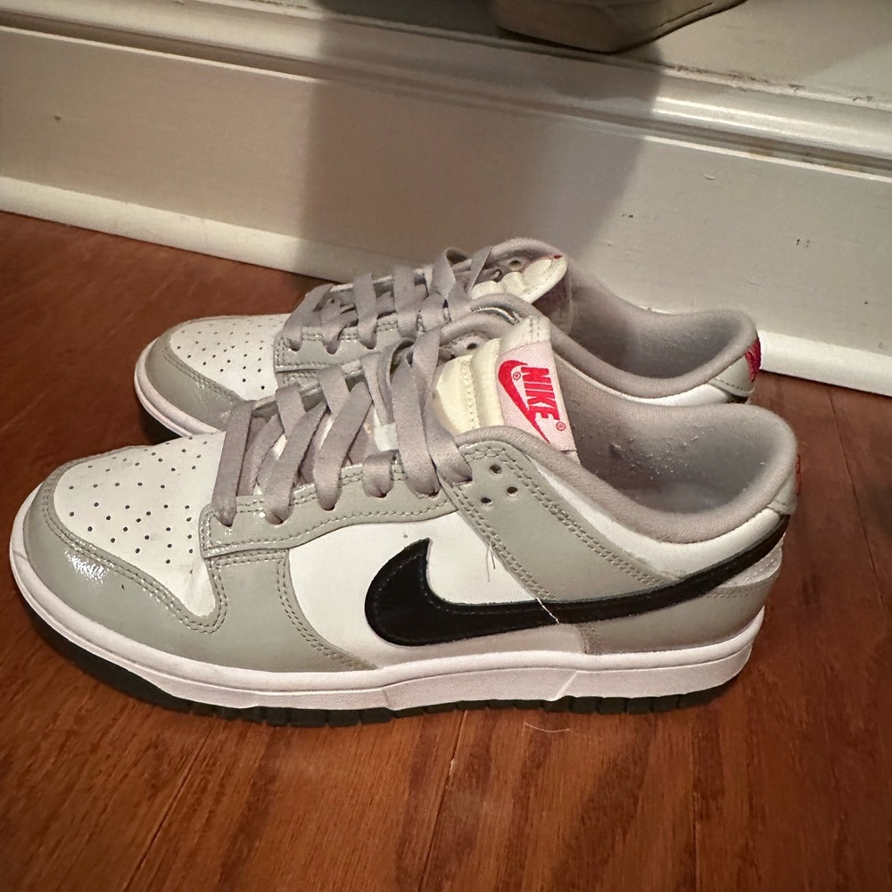 Grey and white with red accents low nike dunks